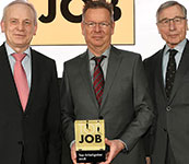 Former German minister for economic affairs, Wolfgang Clement, (right) hands the Top Job seal of quality to Dr Manfred Jagiella, MD, Endress+Hauser Conducta (left), and Stephan-Christian K&#246;hler, director HR, Endress+Hauser Conducta.